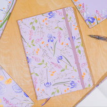 Load image into Gallery viewer, Floral-patterned notebook and cards on a wooden surface with a pen.
