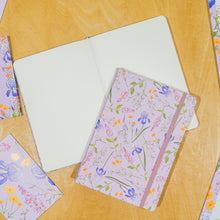 Load image into Gallery viewer, Floral notebook and stationery items on a wooden surface
