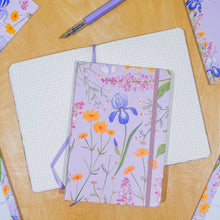Load image into Gallery viewer, Floral notebook with a pen on a wooden surface
